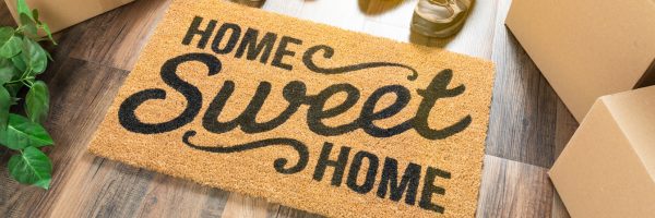 home sweet home image of a doormat of a new home